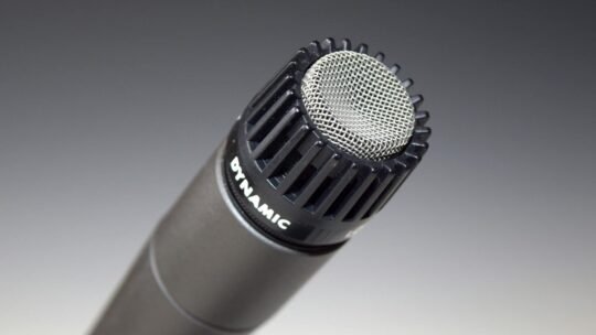 High-quality close-up of a dynamic microphone for audio recording and performance.