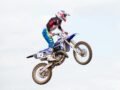 High-action motocross rider capturing air during a thrilling jump in Armthorpe, England.