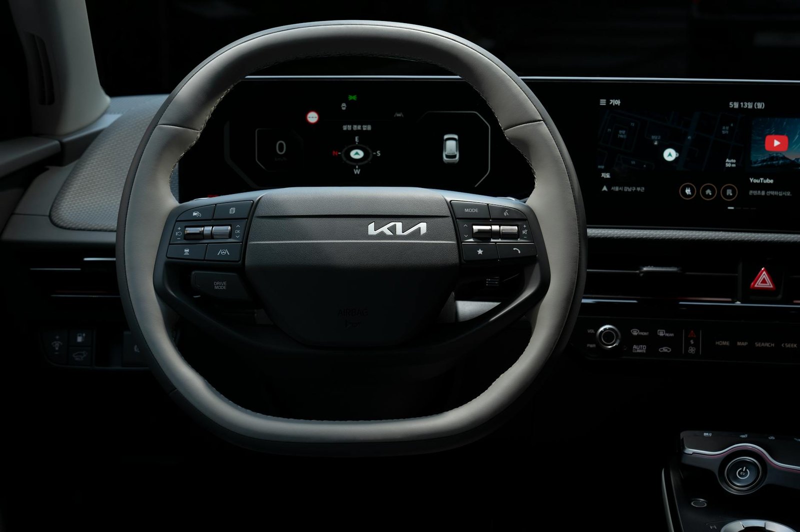 Close-up view of the Kia EV's steering wheel showcasing its modern design and technology.