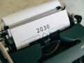 Close-up of a vintage typewriter with the year 2030 typed on paper symbolizing future concepts.