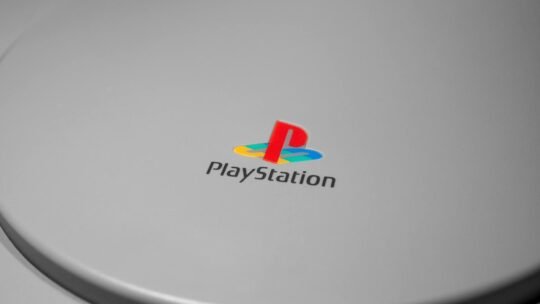 Detailed close-up of iconic PlayStation console logo, perfect for gaming-related content.