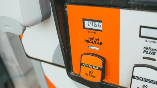 Detailed view of a gas pump showing price and octane level 87.