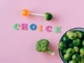 Colorful depiction of healthy and sweet food choices on pink backdrop.